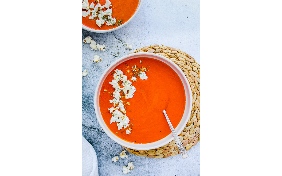 Roasted red pepper soup, goat cheese and popcorn garnish